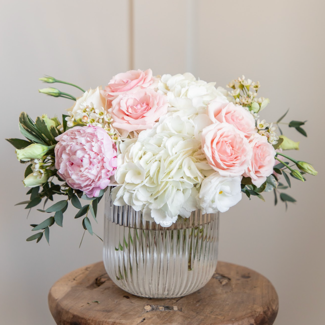 Lovebird Flowers hydrangea, spray rose and peony arrangement.