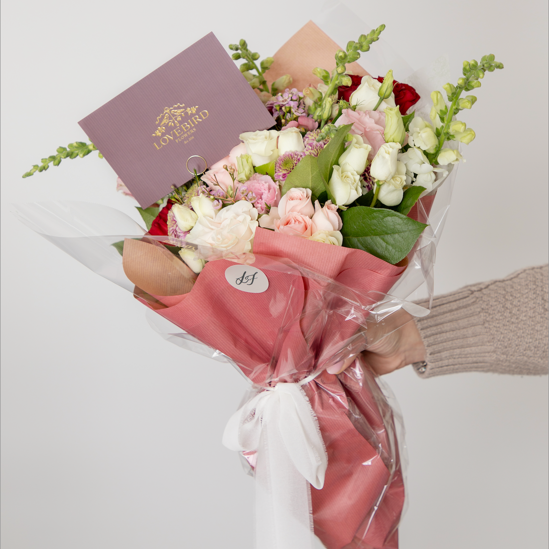 Pink and white bouquet wth premium wrapping from Lovebird Flowers with gold foil notecard
