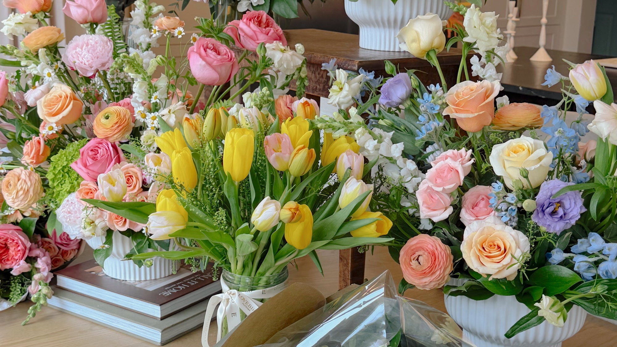 Bouquets of flowers arranged in a decorative manner on a table.