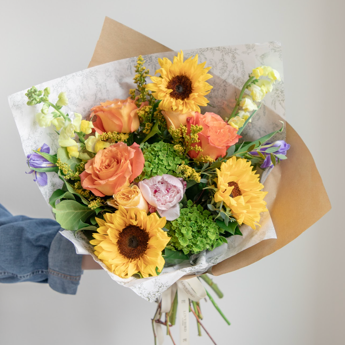 Cheerful sunflower, peony, bright orange, golden rod and hydrangea bouquet from Lovebird Flowers, London Ontario's top rated florist