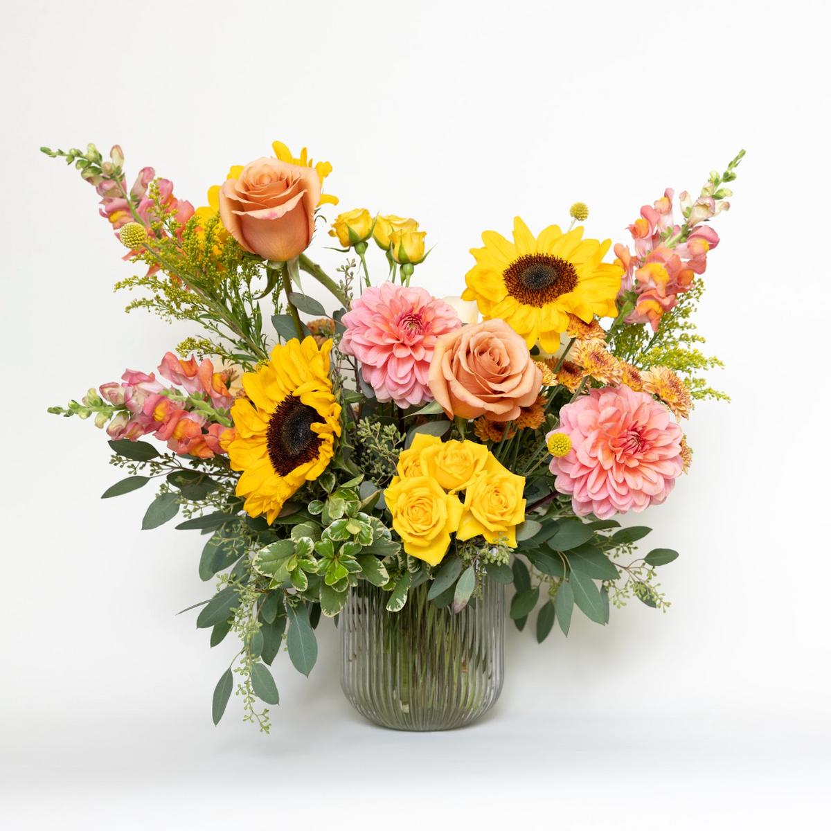 sunflower, dahlia, snapdragon and rose textural garden style floral arrangement